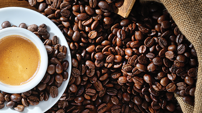 Coffee beans and a cup of coffee